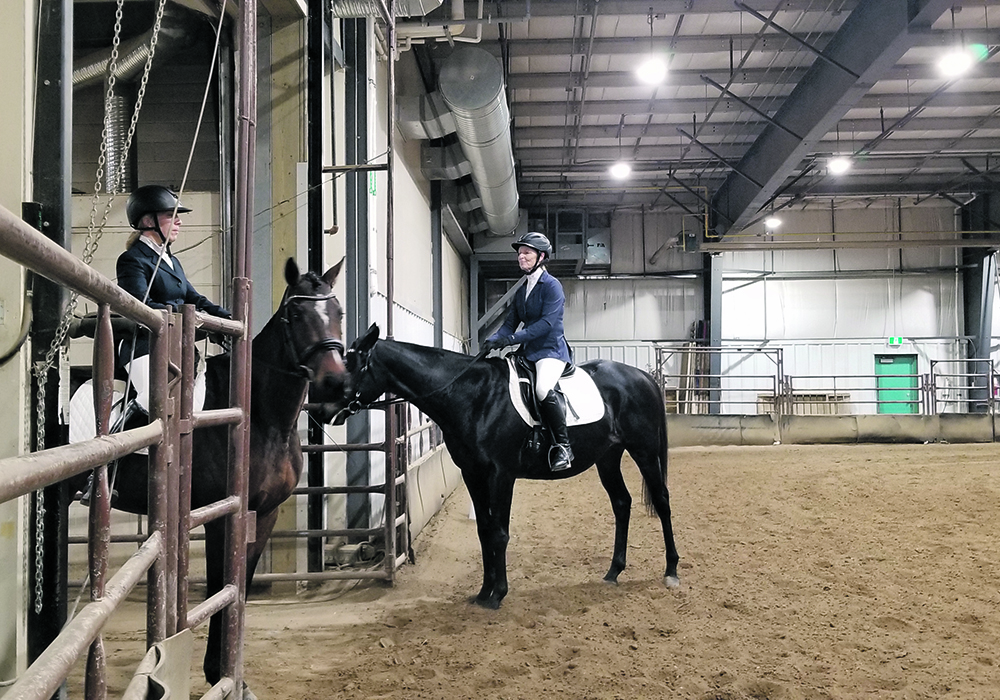Ilse Dedden on Vienna and Gayle Smith on Black Dialya enter and exit the ring for the dressage test during the recent Off-Track Thoroughbred Challenge in Saskatoon. | Elizabeth Ireland photo