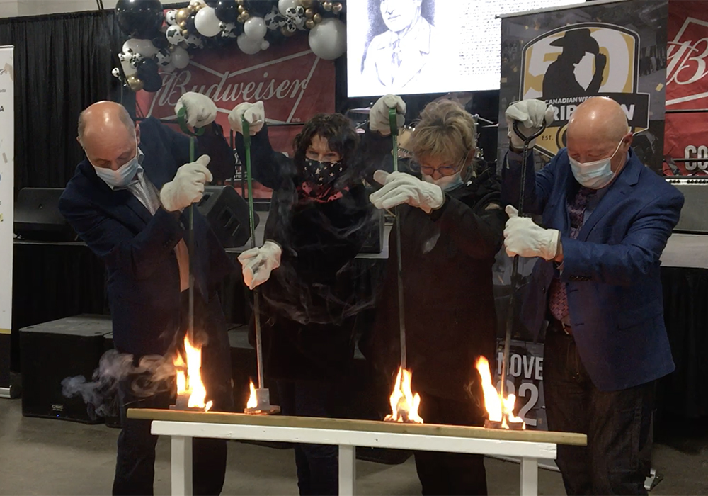 Dean, Gail, Janice and Spence Sutter open Canadian Western Agribition's 50th anniversary show with the traditional burning of the brand. Spence and Dean’s father, Christian Sutter, was one of the original founders of Agribition. | Karen Briere photo