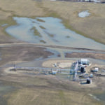 An aerial view shows what Grande Prairie-area farmer Glen Goertzen says is an access road to a natural gas installation that blocked water from running off his field during the spring melt, causing flooding on his property and delayed seeding. | Glen Goertzen photo