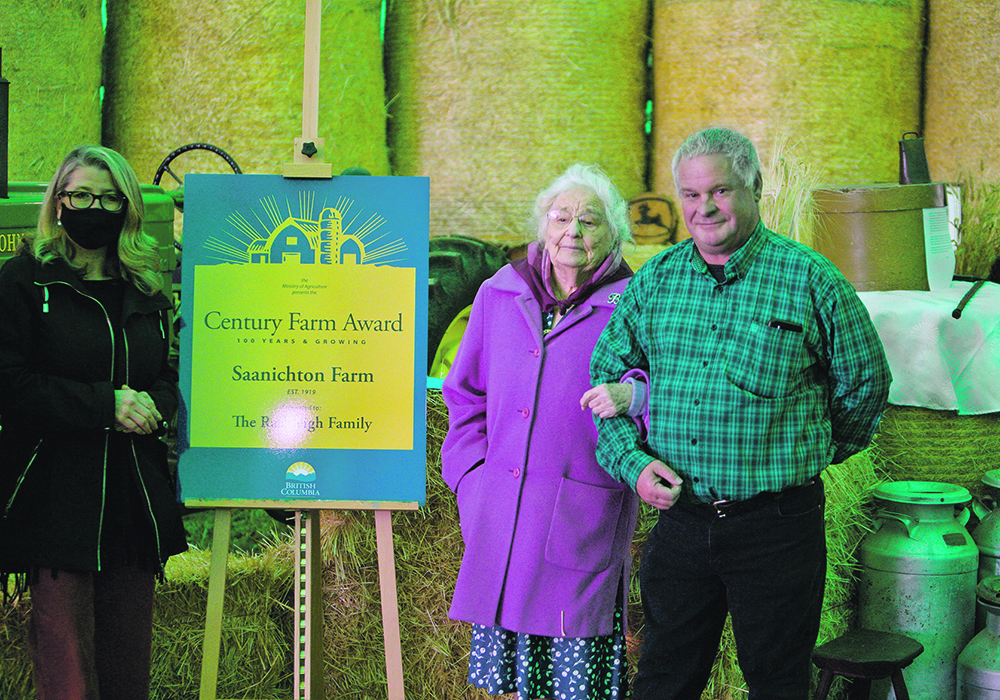 British Columbia agriculture minister Lana Popham, left, presents Bryce Rashleigh and his aunt, Betty Rashleigh, with the Century Farm and Ranch Award for their family operation, Saanichton Farm. | Supplied photo