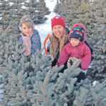 Amanda Kappeler (middle) is shown with neighbours on her family’s Fir Ever Green Farm near Falun, Alta. | Kappeler photo
