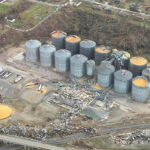 Mayfield Grain Company had roofs ripped off of parts of a storage system that holds 6 million bushels of grain in Mayfield. That's enough corn to fill two Panamax vessels - each ship the length of two football fields. | Facebook/Mayfield Grain Company photo