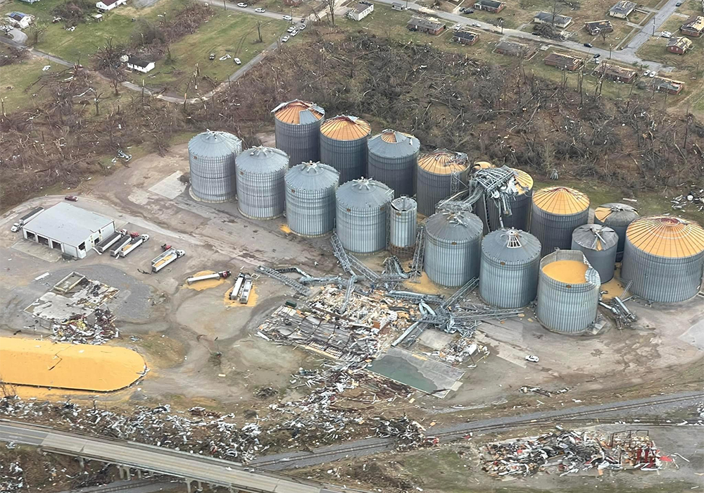Mayfield Grain Company had roofs ripped off of parts of a storage system that holds 6 million bushels of grain in Mayfield. That's enough corn to fill two Panamax vessels - each ship the length of two football fields. | Facebook/Mayfield Grain Company photo
