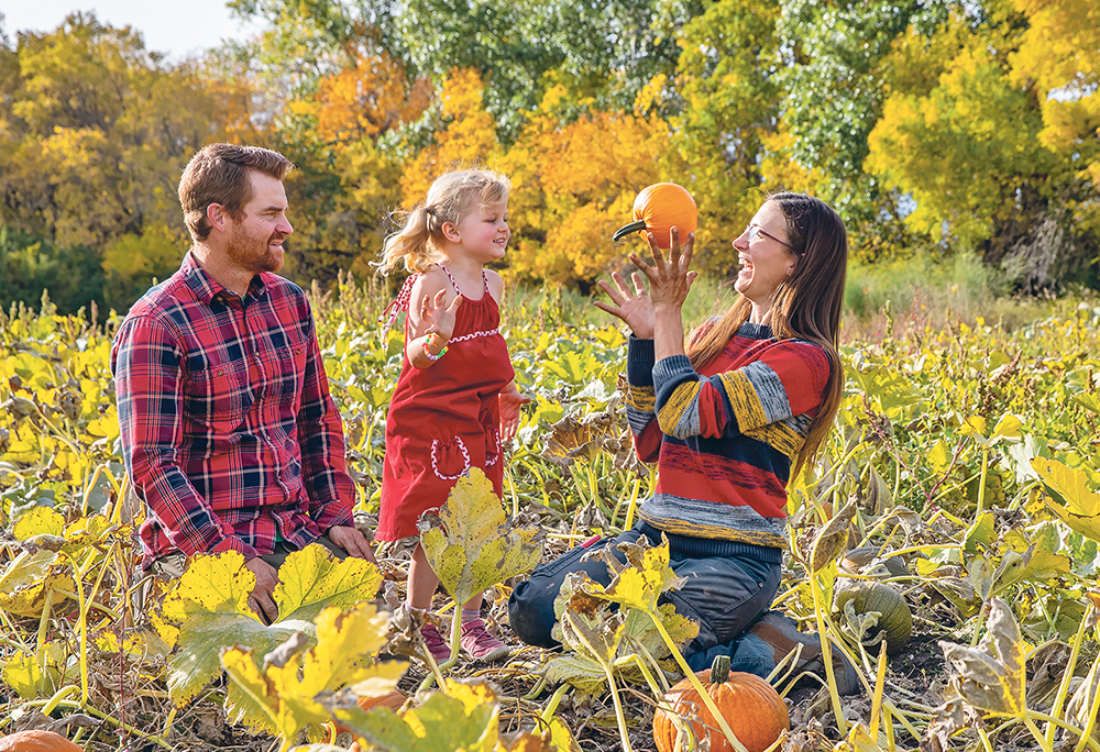 Jon Jenkins, left, Myra Jenkins and Teri Jenkins sit in their pumpkin patch. Teri and Jon run Brown Sugar Produce after they bought out Teri’s mom in 2021. | Sandy Black photo