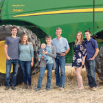 The Sattler family, from left to right: Kyle, Bailey, Pam holding Kyle and Bailey’s son Nathan, Brent, Jenna and Kelvin, on the Milestone, Sask. area farm before selling earlier in 2021. PHOTO BY TAMMY THOMAS, MAQUOKETA MOMENTS PHOTOGRAPHY