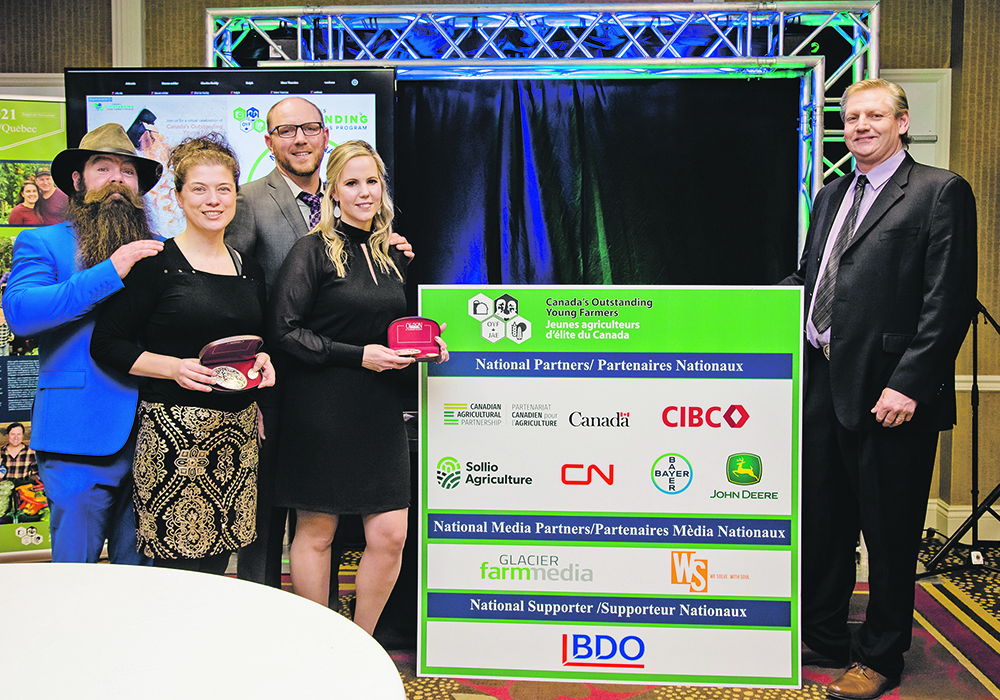Wes Kuntz, left, Jenny Butcher, Raymond Bredenhof and Tracey Bredenhof pose with Canada’s Outstanding Young Farmers Program chair Steve Cooper after winning the 2021 competition last month. | Supplied photo