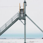 When climbing to the tops of rail cars, workers snap their safety harness to a cable that resembles a zip line. Worker safety was a number one priority in the design. | Ron Lyseng photo