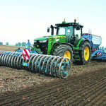 This is a typical European seeding setup, says Lemken's Mark VanDeursen. The tractor carries a 20-foot wide hydraulic downforce packer at the front, a 20-foot wide, three-point hitch drill at the back, pulling a cart with all seed and fertilizer. In some situations, the rig can do this operation directly into a plowed field. The new updated version of VarioPack has heavier packing wheels. | Lemken photo