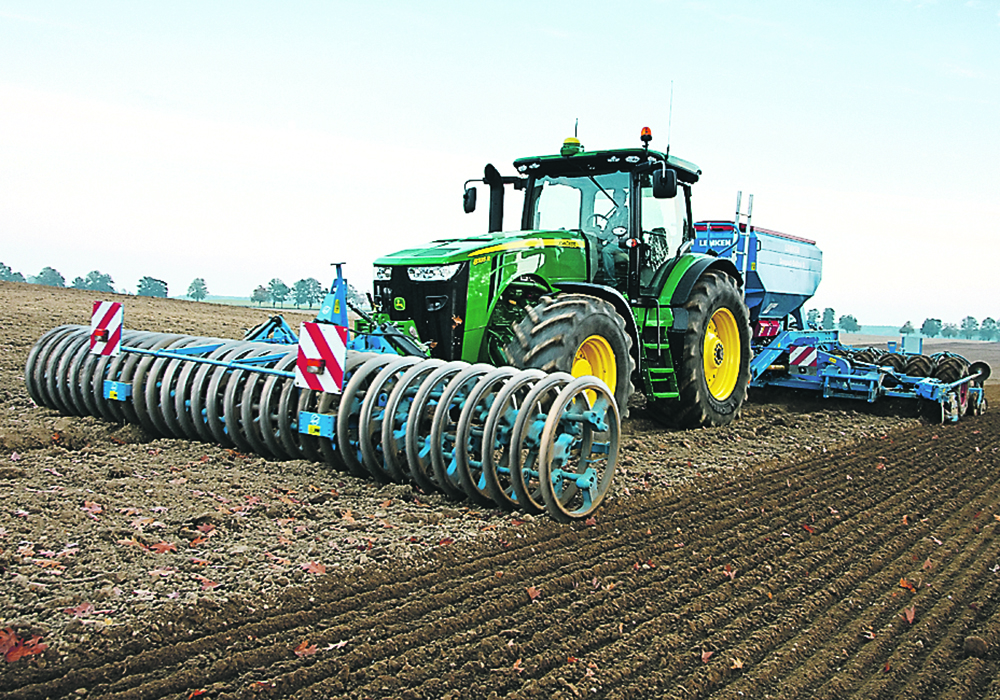 This is a typical European seeding setup, says Lemken's Mark VanDeursen. The tractor carries a 20-foot wide hydraulic downforce packer at the front, a 20-foot wide, three-point hitch drill at the back, pulling a cart with all seed and fertilizer. In some situations, the rig can do this operation directly into a plowed field. The new updated version of VarioPack has heavier packing wheels.  |  Lemken photo