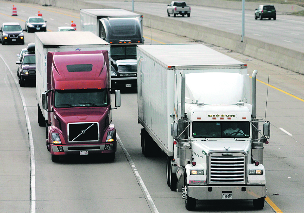 A November survey of U.S. truck drivers found that 55 percent were vaccinated, nine percent intended to become vaccinated and 36 percent did not intend to become vaccinated. | Reuters/Rebecca Cook photo