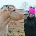 Pascalle Van Der Kraan gets some affection from one of her Norwegian Fjord horses at her stable in Ranier, Alta. | Alex McCuaig photo