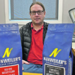 Russ Schroeder, owner of Marquis Milling & Grain, includes the name of the farmer who produced the organic grain that goes into each bag of Nunweiler’s Flour. | Brian Cross photo