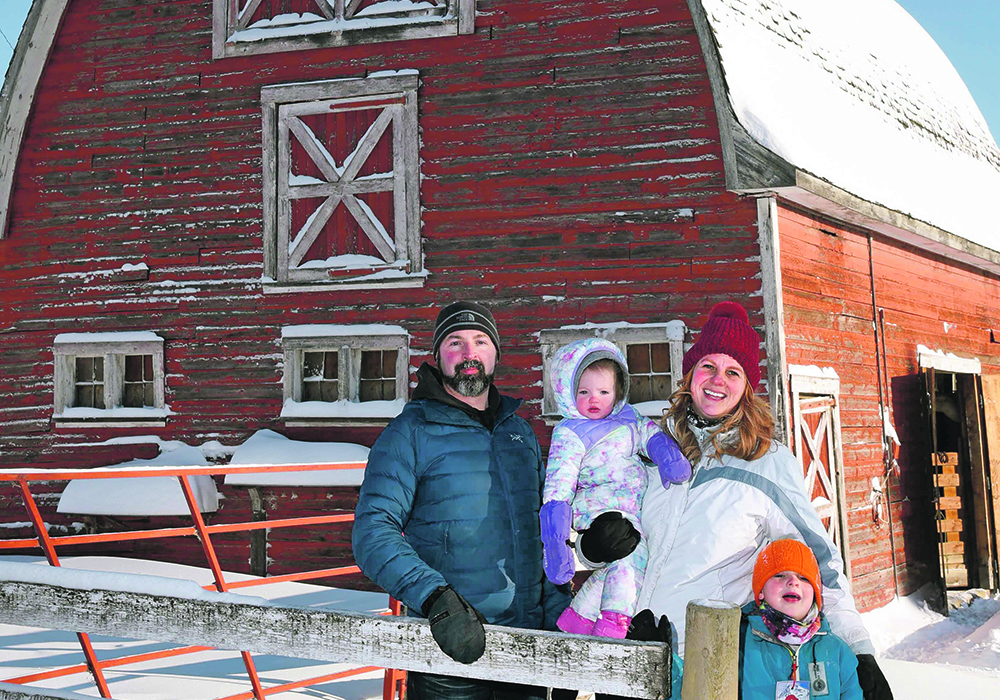 Colin and Andrea MacDonald, with their children Graham, 5, and Alison, 1, farm near Henribourg, Sask. | William DeKay photo