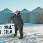 Miles Moore put this sign at the entrance to his farm near Outlook, Sask., after 1,800 bushels of canola were stolen from one of his bins last fall. | William DeKay photo