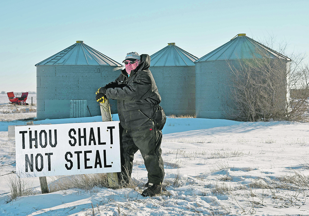Miles Moore put this sign at the entrance to his farm near Outlook, Sask., after 1,800 bushels of canola were stolen from one of his bins last fall. | William DeKay photo