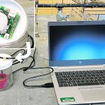 Measuring CO2 flush is possible with only one day of incubation following rewetting of dry soil in a glass jar. The flush is absorbed by an infrared analyzer attached to the inside cover of the jar (inset, upper left) and read on a laptop computer. | Upendra Sainju photo