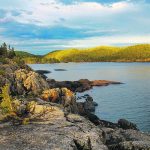 Pukaskwa National Park in Ontario preserves 135 kilometres of rugged coastline on Lake Superior with a combination of ancient granite bedrock, mixed forest, golden sand beaches and stunning views. | Robin and Arlene Karpan photo