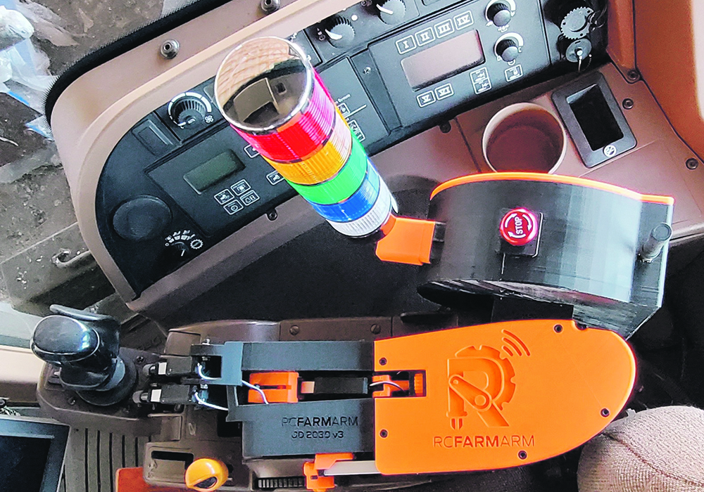 The RCFarmarm won the Farm Built Solutions category. The arm lets a farmer control a tractor remotely with a wireless control while doing stationary PTO work.  |  Manitoba Ag Days photo
