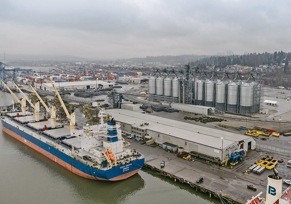 The Fraser Grain Terminal, located on the Fraser River in Surrey, B.C., has on-site storage of 74,000 tonnes, including 20 3,500-tonne steel storage bins and six 500-tonne bins for on-site container loading. | GrainsConnect Canada/FGT photo