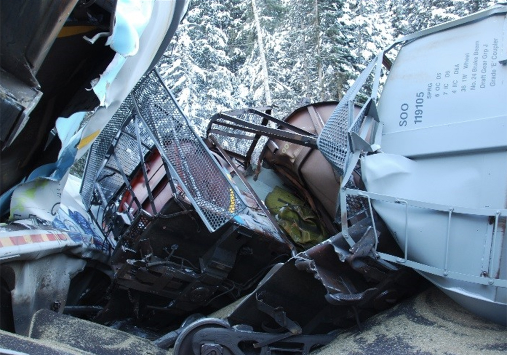 The recommendations were outlined during a TSB news conference, held March 31 in Calgary, approximately three years after a 112-car grain train derailed on CP's mountainous Laggan subdivision near Field, killing all three members of the train crew aboard. | Flickr/TSB photo