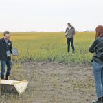Discovery Farm's Applied Research Lead Blake Weiseth speaks on the Water Management Project to a group of stakeholders at a site tour,
August 17, 2021.
