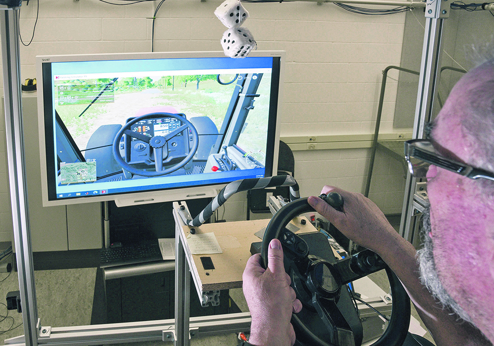 Dr. Stephan Milosavljevic from the University of Saskatchewan’s School of Rehabilitation Science operates a simulated tractor vibrating over rough ground. The school is looking for volunteer farmers to hop into the simulator to study long-term exposure of whole-body vibration and methods to minimize it.  |  William DeKay photo
