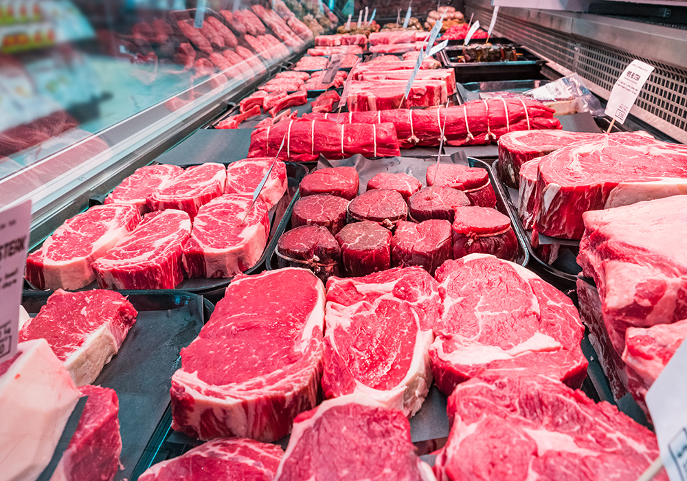 Companies like Tyson say they have hiked prices to offset rising costs for labor and goods like animal feed, which has been accelerated by the war in Ukraine. | Getty Images