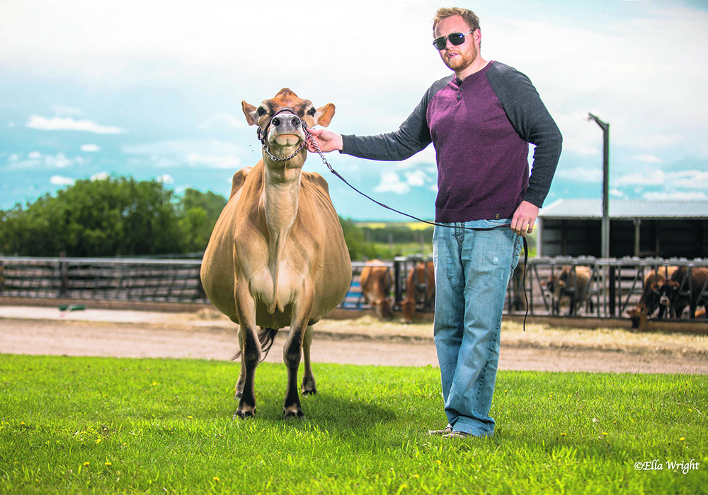 Michael Haeni with one of his family’s dairy cows.  |  Supplied photo