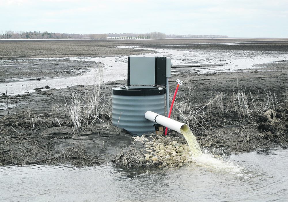 Tile drainage systems, like this one near Altamont, Man., are working overtime this spring as snowstorms and heavy rain saturate fields across the province. | Jeannette Greaves photo