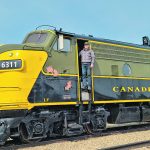 Gary Southgate stands on one of the train engines he will be using for the Eastend Scenic Rail Tours this summer. | Supplied photo