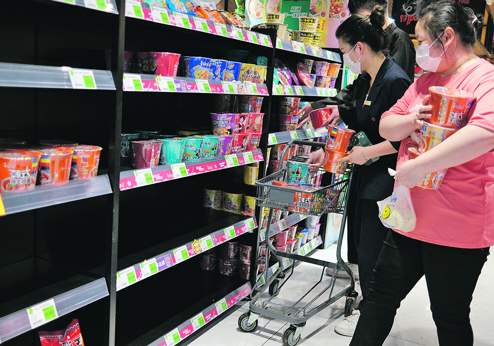 Consumers at supermarkets, like this one in Beijing, China may be seeing higher noodle and bread prices in the near future as grain prices rise.  |  Reuters/Tingshu Wang photo