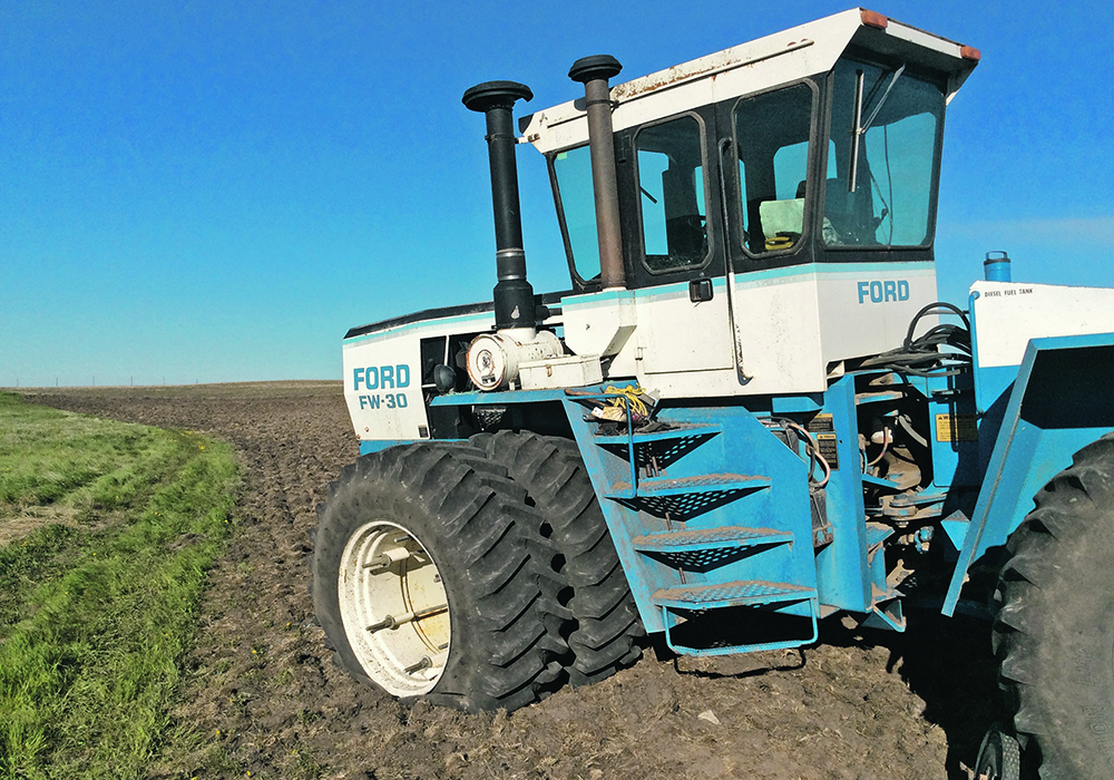 The Rourke family found their tractor and seeding rig had been shot repeatedly near Morse, Sask. The windshield and tires were blown out and the seed cart dented.  |  Rourke Farm photo