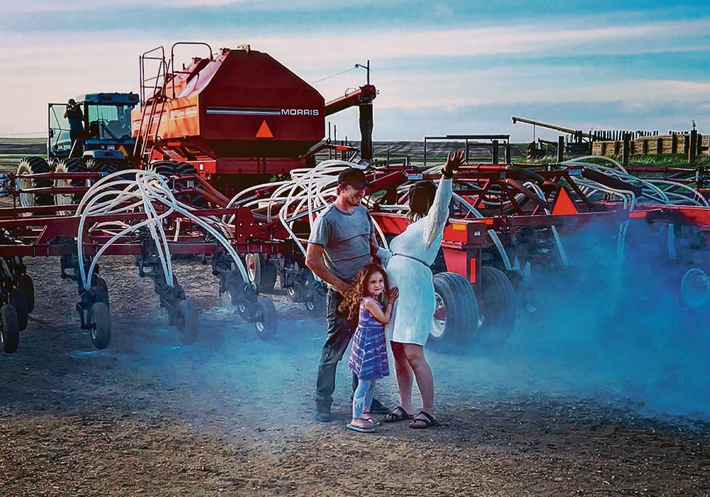 Erik Kohlenberg, Ashley Neubeker and Neubeker’s daughter Tessa celebrate the gender reveal.  |  Ashley Neubeker photo
