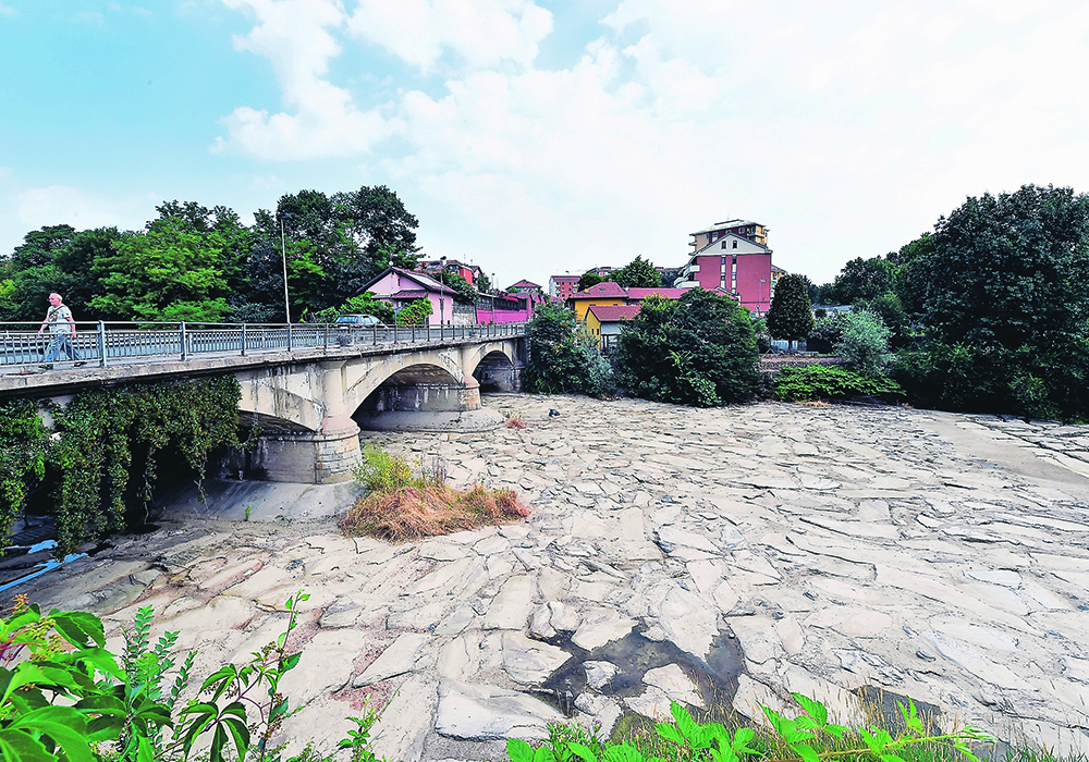 The Sangone River, a tributary of the Po, recently ran dry in an area of northern Italy near Turin. The Po is a major crop irrigation source and the region is now experiencing its worst drought in 70 years.  |  Reuters/Massimo Pinca photo
