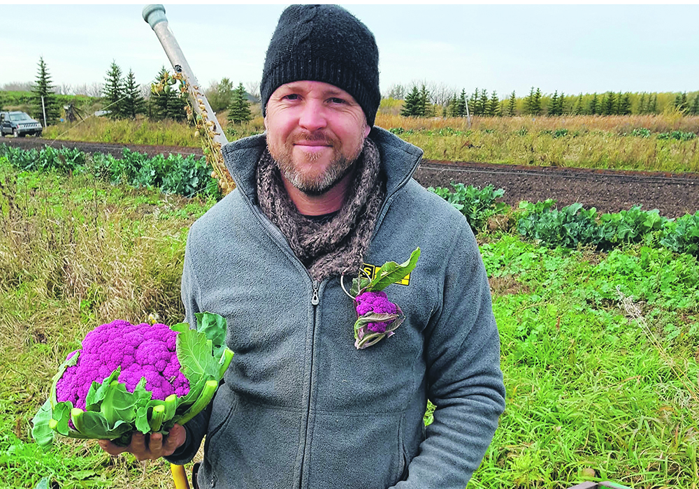 Stefan Regnier, owner of Blue Lagoon Organics in St. Francois Xavier, Man., takes the time to get to know his regular customers.  |  Photo supplied by Direct Farm Manitoba