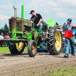 Mike Johnson of Bashaw, Alta., tries to get the last inch out of his tractor during the antique tractor pull event at the LA Vintage Machinery Club event in Lacombe, Alta. The 1952 John Deere G tractor is one of six antique tractors Johnson owns. | Mary MacArthur photo