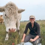 Jessica Grenke, lead author of a new study of multi-paddock grazing, gets some help while sampling plant diversity. | Emily Holden photo