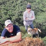 Dwight and Tanya Odelein, along with Brandi in a crop of alfalfa planted on some of their saline land. | file photo