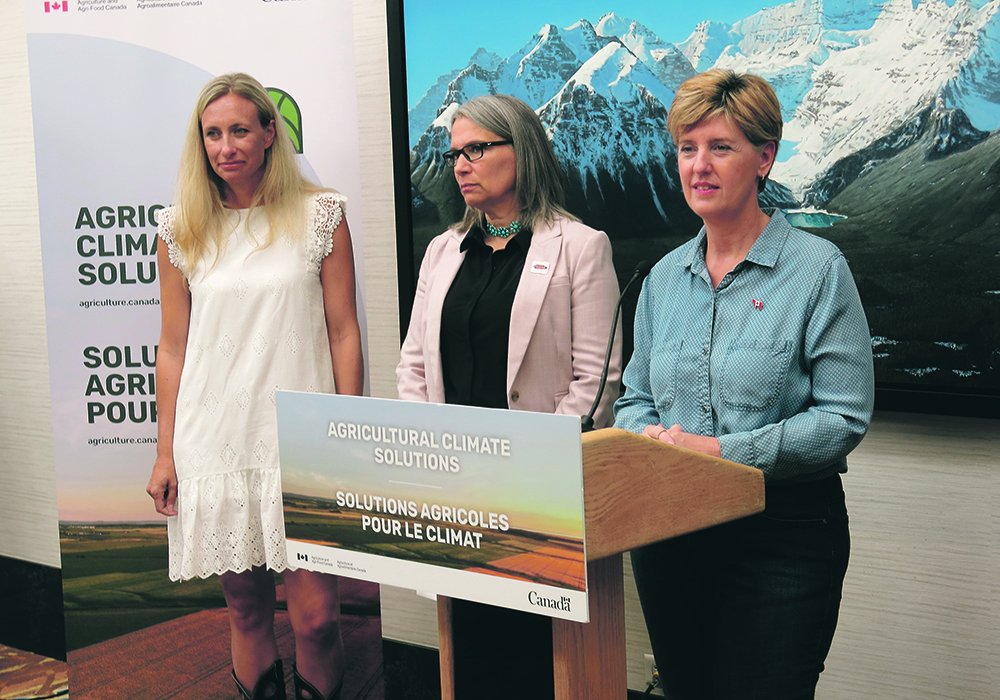 Kimberley Cornish, left, of the Food Water Wellness Foundation, Melanie Wowk of Alberta Beef Producers and federal agricultural minister Marie-Claude Bibeau participated in a recent living labs announcement in Calgary.  |  Doug Ferguson photo