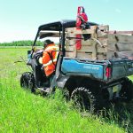 Craig Kaartinen removes electric wire and portable posts after letting the herd into the fresh paddock so that he can create another paddock. | Charlene Kaartinen photo
