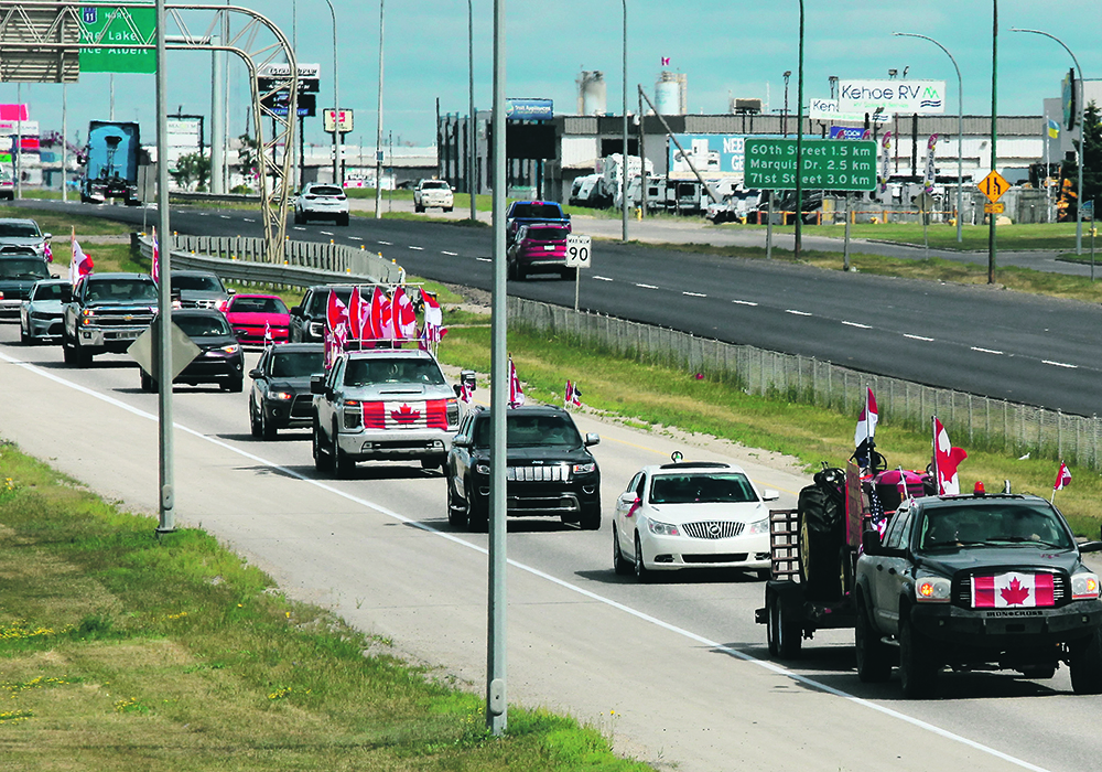 Protesters took to the roads, slowly, in Saskatoon July 23. About 75 cars and light trucks, without farm equipment, drove below posted limits in the city. The automotive march was said to be organized in support of Dutch farmers, but many of the protest signs pointed toward dissatisfaction with vaccine mandates, international travel restrictions due to COVID-19 and carbon taxes. A few signs called for support of farmers locally.  |  Mike Raine photo