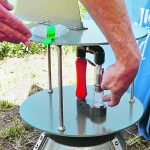 Tim Dumonceaux points at an air sampler that was used in the Ag Canada booth at Ag In Motion. Samples were collected so that event attendees could test them for sclerotinia. | Robin Booker photo