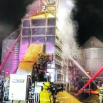 This nighttime photo shows the frustrating futility of fighting a dryer fire from the outside, especially now that systems are available to put sprayer sprinklers inside the dryer. Human safety is another major benefit in keeping firefighters further away from the fire. This 2019 fire in barley occurred near Star City, Sask. | Melfort Fire and Rescue photo