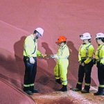 Deputy Prime Minister Chrystia Freeland examines a handful of granular potash during her tour of the Mosaic potash and phosphate mine east of Colonsay, Sask., Aug. 24. | William DeKay photo
