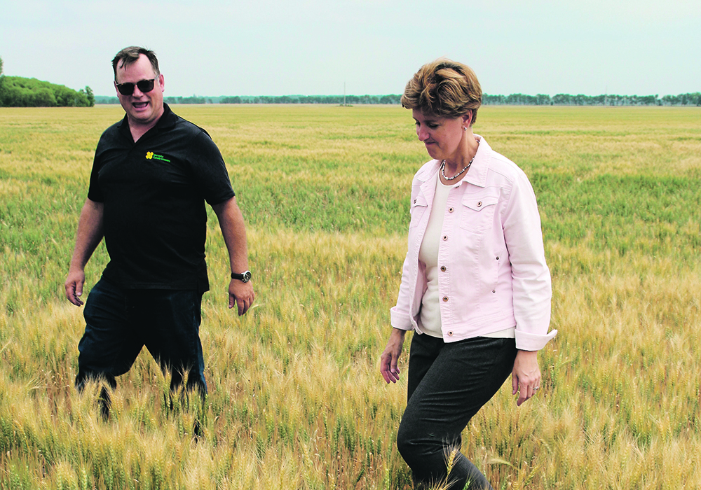 Last season Marie-Claude Bibeau visited Curtis McRae’s farm north of Winnipeg on a tour of drought-struck regions. Times are better in 2022.  |  Ed White photo