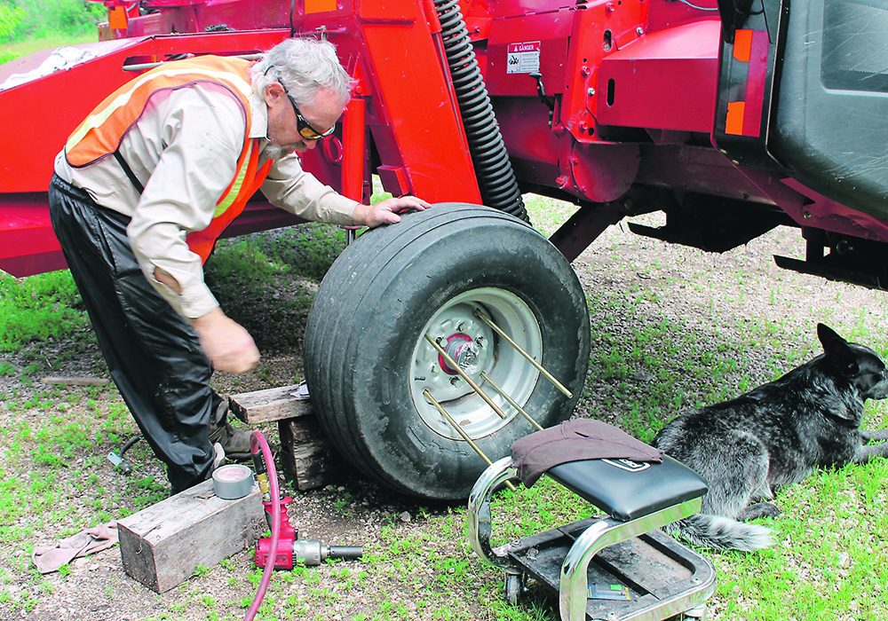 Craig Kaartinen puts the four rods in place, which are ready to accept the empty rim. | Charlene Kaartinen photo