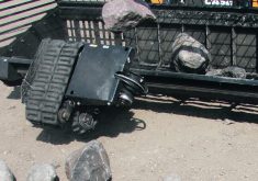 The TerraClear rubber belt system launches rocks with ease, tossing rocks as heavy as 400 pounds. Two high-speed drive belts below the rock and one belt on top handles rocks exceeding two feet in size.  |  Ron Lyseng photo