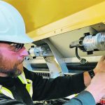 SeedMaster service manager Murray Soanes installs the electric metering motors that provide singulated seed selection. Company CEO Don Henry worked evenings and weekends to help assemble drills. | Photo supplied by SeedMaster