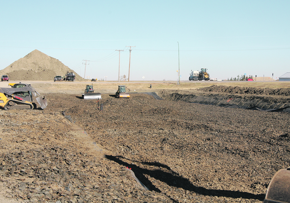 Contractors recently expanded an old dugout and filled it with tire derived aggregate on John Metz’s property at Corinne, Sask. The project is preparation for twinning Highway 6. | Karen Briere photo