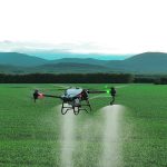 The Pest Management Regulatory Agency is developing guidelines for getting remotely piloted aircraft system (RPAS) on the label of crop protection products, but stakeholders say the process is taking too long. In this photo a DJI T40 sprays a crop. | DJI Photo